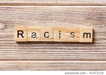 Racism word written on wood block. 41471538