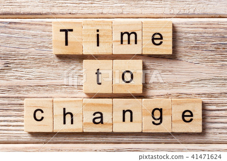 TIME TO CHANGE word written on wood block. 41471624