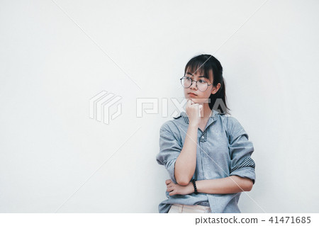 Portrait of thinking young woman Portrait of thinking young woman 41471685