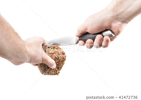 Man is ready to cut bread 41472736