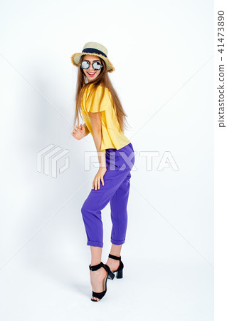 adorable model standing in hat and casual clothes adorable model standing in hat and casual clothes 41473890
