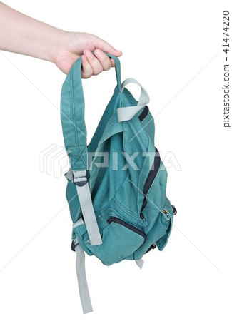 Hand Holding A Classic Green Fabric Backpack Hand Holding A Classic Green Fabric Backpack 41474220