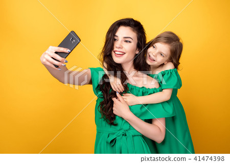 Awesome mother with daughter taking selfie 41474398