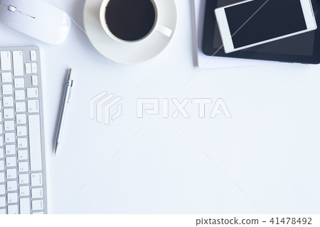 Top view of an desk office table. White office des Top view of an desk office table. White office des 41478492