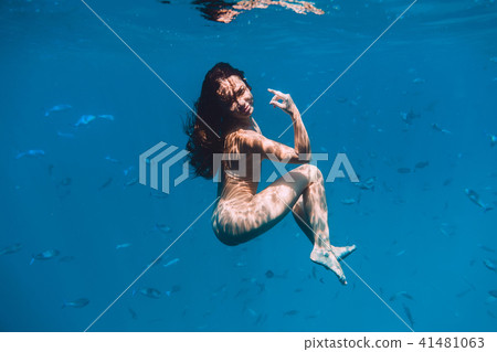 Naked young woman is underwater. Beautiful woman Naked young woman is underwater. Beautiful woman 41481063