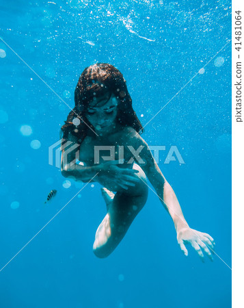 Naked young woman is underwater. Beautiful woman 41481064