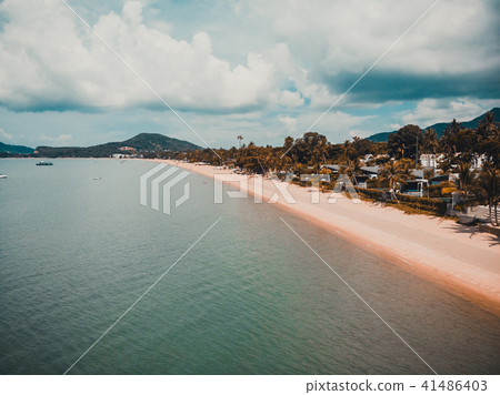 Aerial view of beautiful tropical beach and sea with palm and other tree in koh samui island Aerial view of beautiful tropical beach and sea with palm and other tree in koh samui island 41486403
