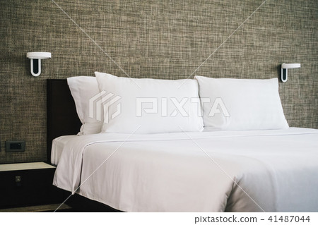 White pillow on bed decoration interior White pillow on bed decoration interior 41487044