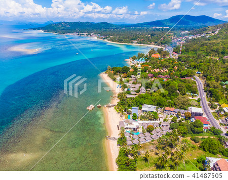 Beautiful aerial view of beach and sea with many tree and white cloud on blue sky in koh samui island 41487505