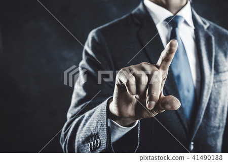 A businessman pointing a finger 41490188