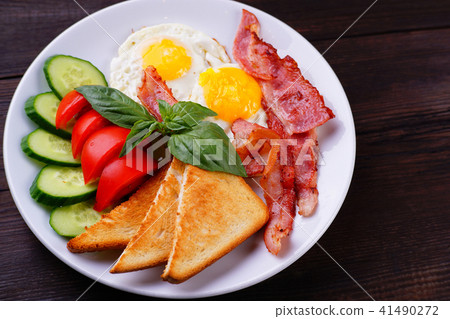 European breakfast- fried eggs with bacon European breakfast- fried eggs with bacon 41490272