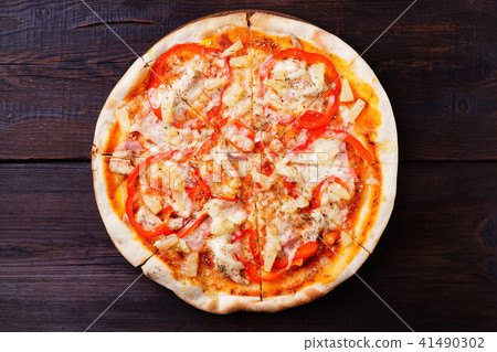 Hawaiian pizza with pineapple and ham Hawaiian pizza with pineapple and ham 41490302