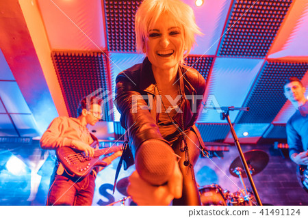 Singer of band on stage during gig or concert Singer of band on stage during gig or concert 41491124