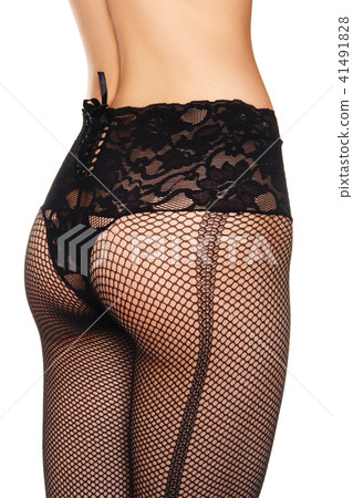 Female buttocks inlace fishnets rear view. 41491828