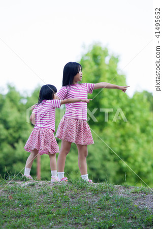 Children sister playing in the summer park Children sister playing in the summer park 41495652