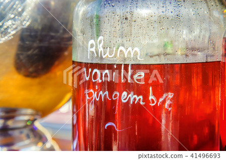 Bottle of rum with ginger drink in background Bottle of rum with ginger drink in background 41496693