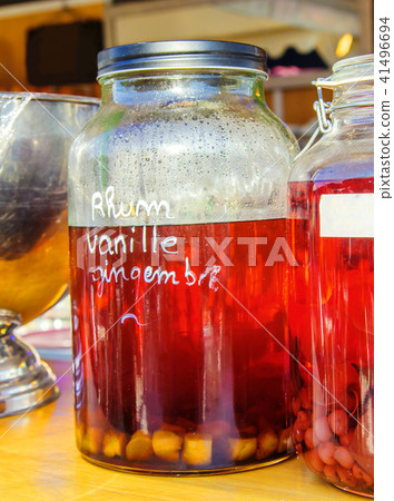 Bottle of rum with ginger drink in background Bottle of rum with ginger drink in background 41496694