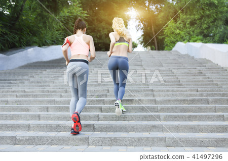 Runners training outdoors working out in the park Runners training outdoors working out in the park 41497296