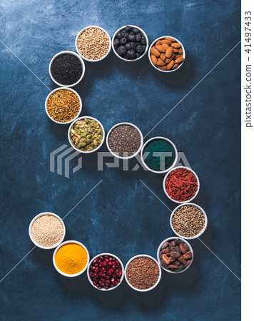 S letter of superfoods in bowl on blue background 41497433