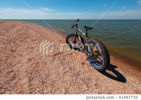Fat Bike in the summer on the beach. Cycling and active lifestyle Fat Bike in the summer on the beach. Cycling and active lifestyle 41497720