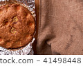 Apricot cake baked in foil on a wooden table 41498448