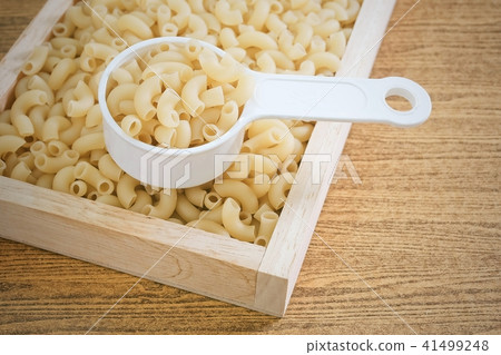 Elbow Macaroni or Gomiti Pasta in Measuring Cup Elbow Macaroni or Gomiti Pasta in Measuring Cup 41499248