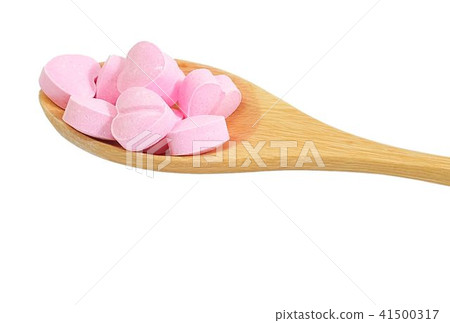 Wooden Spoon Full with Vitamins C on White 41500317