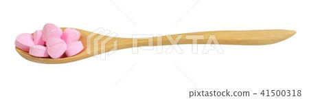 Wooden Spoon Full with Vitamins C on White 41500318