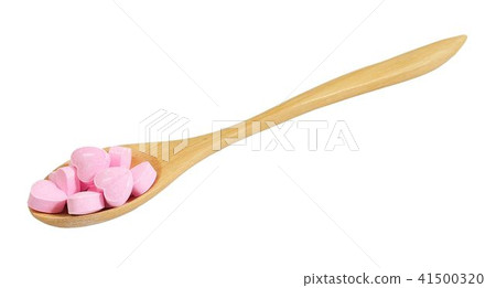 Wooden Spoon Full with Vitamins C on White 41500320