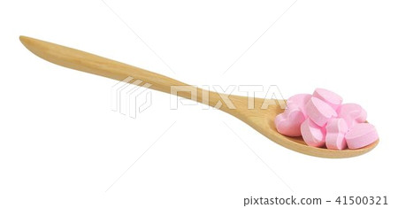 Wooden Spoon Full with Vitamins C on White 41500321