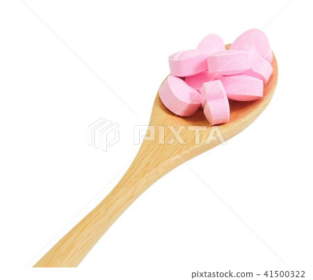 Wooden Spoon Full with Vitamins C on White 41500322