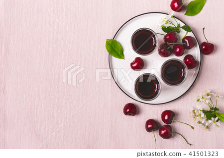 Cherry drink liquor brandy on pink background Cherry drink liquor brandy on pink background 41501323