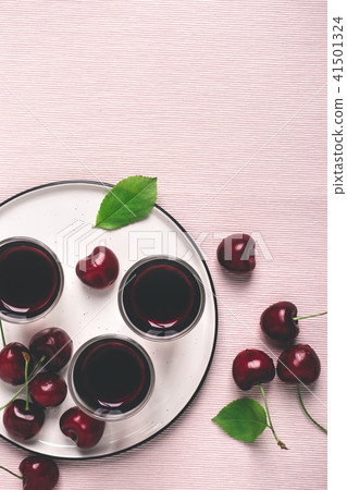 Cherry alcohol liquor or brandy on pink background Cherry alcohol liquor or brandy on pink background 41501324