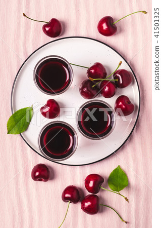 Cherry alcohol drink liquor on pink background 41501325