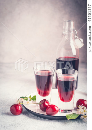 Cherry alcohol drink liquor on pink background 41501327