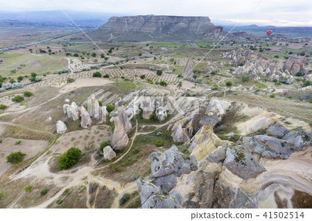 Balloons fly over the valleys in Cappadocia Balloons fly over the valleys in Cappadocia 41502514