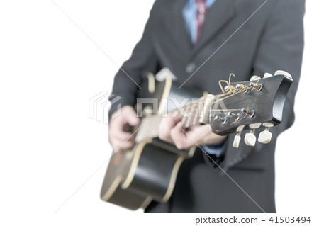 Businessman with guitar on white 41503494