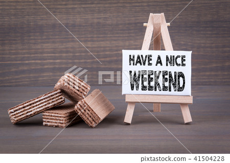 Have a nice weekend. Waffles with sweet filling on a wooden background Have a nice weekend. Waffles with sweet filling on a wooden background 41504228