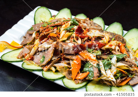 Chinese cuisine, boiled beef with cucumber and tomato in white plate, on black background Chinese cuisine, boiled beef with cucumber and tomato in white plate, on black background 41505835