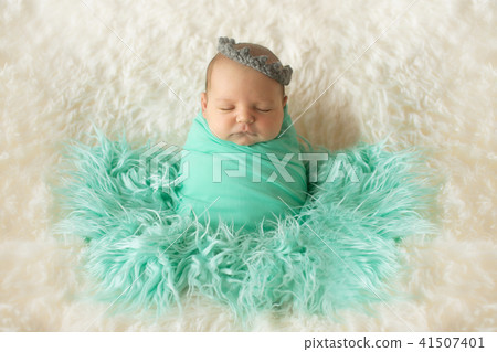 A little child in a diaper lies. Portrait of newborn 41507401