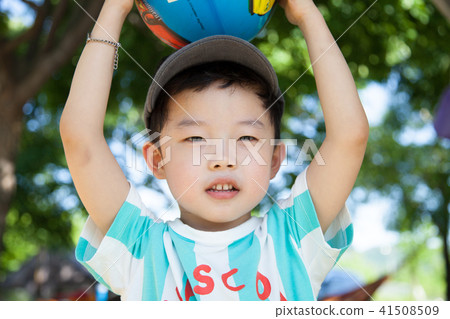 A boy playing a game in a campsite 41508509