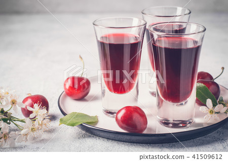 Cherry alcohol drink liquor on pink background 41509612