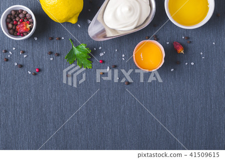 Mayonnaise sauce and ingredients on blue cloth Mayonnaise sauce and ingredients on blue cloth 41509615