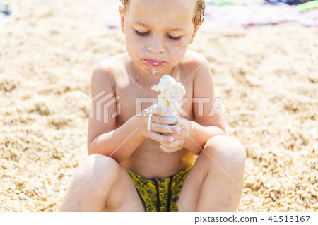 Boy eating ice cream Boy eating ice cream 41513167