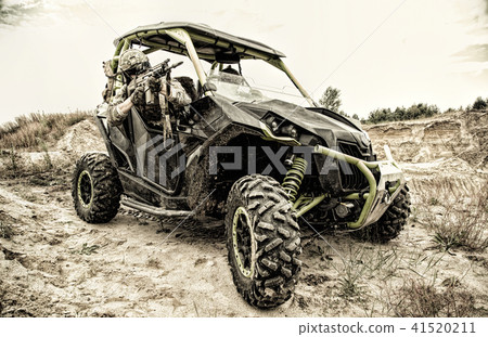 Commando shooting from fast attack vehicle 41520211