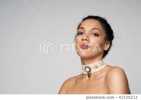 Beauty profile portrait of beautiful mixed race woman wearing chocker 41520212