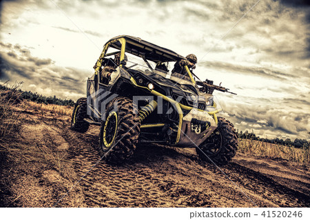 Mobile infantry team goes on military buggy Mobile infantry team goes on military buggy 41520246