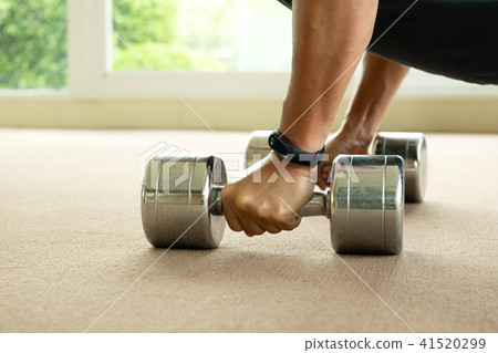 Sport man working out with dumbbells in gym Sport man working out with dumbbells in gym 41520299