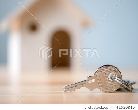House key with wooden home background blurred 41520819
