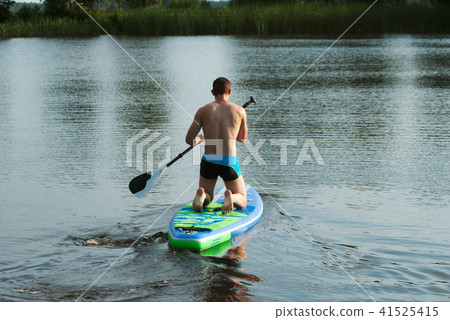 A man floats on a sup Board on the lake, A man floats on a sup Board on the lake, 41525415